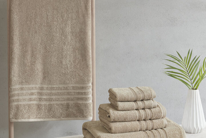 Complete your bathroom decor with our Clean Spaces Nurture Sustainable Antimicrobial 6PC Towel Set. This eco-friendly solid natural towel set is made from regenerated cotton and recycled polyester fibers safeguarding our resources for a better carbon footprint