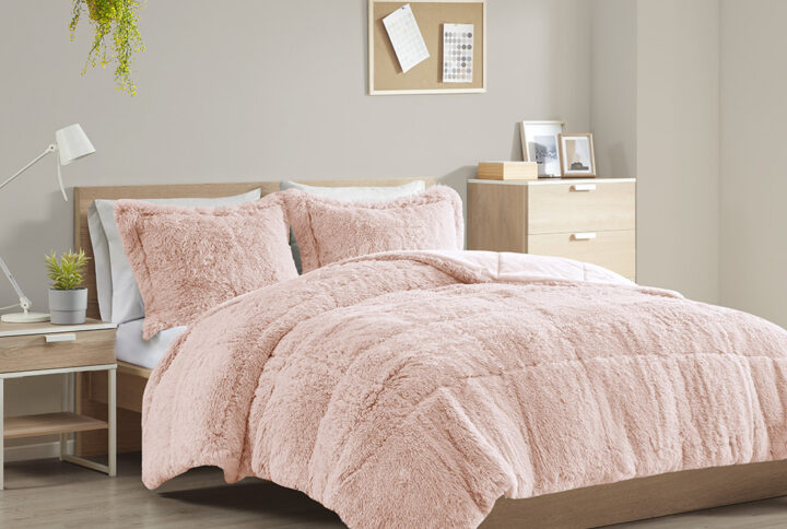 The Intelligent Design Malea Shaggy Long Fur Comforter Mini Set brings a soft contemporary update to your bedroom. The comforter and shams (1 in Twin/TwinXL) feature stylish shaggy faux fur that creates a soft fluffy texture and modern look. The solid plush reverse adds a soft and warm touch. Items in the set may come in a rolled or compressed packaging