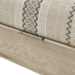 for blankets and other essentials. The solid wood legs and frame complement the upholstery with a natural wood finish