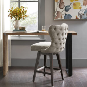 The Madison Park Hancock Swivel Counter Stool complements any decor with its simple