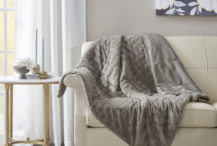 Keep yourself warm and cozy with the Arctic plush throw. The ultra plush fabric is incredibly soft and features a checkboard design for added texture and dimension. This throw is machine washable for easy care and is also OEKO-TEX certified