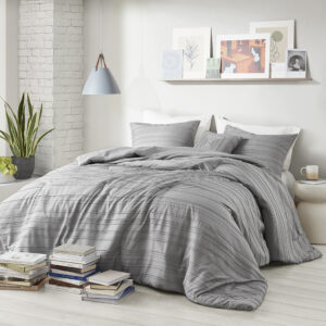 Add a casual and modern touch to your bedroom with the Oliver clip jacquard comforter set. The comforter and matching shams (1 in Twin/Twin XL) feature a woven striped pattern and clip jacquard design for a contemporary update to your bedroom