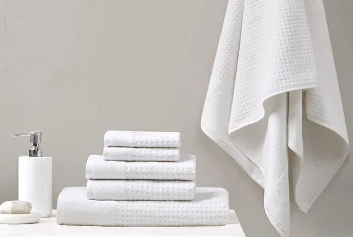 Our Madison Park Spa Waffle Cotton Towel 6 Piece Set provides the perfect textured update to your bathroom decor. This 100% cotton towel set features an all-over waffle combed jacquard design for a rich texture