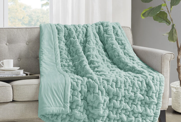 Add a modern and sophisticated touch to any space with the Madison Park Ruched Fur Throw. This throw features a solid ruched fur pattern