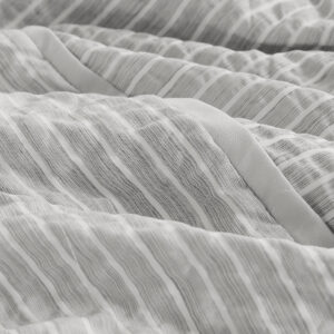 you will create a relaxing vibe in your bedroom. The oversized comforter features ivory stripes on soft gray seersucker fabric that pair well with both solids and patterns. A soft microfiber reverse adds extra comfort and matching shams complete the casual cozy look