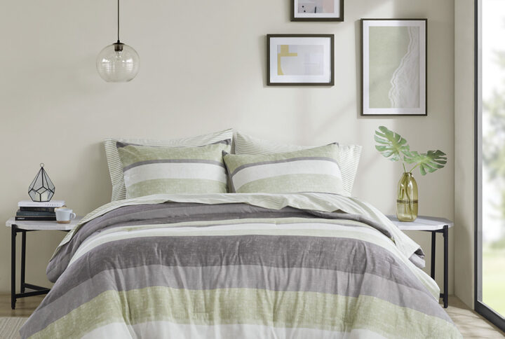 Revamp your bedroom style with the Madison Park Essentials Jaxon bed in a bag. This modern comforter set features a stripe pattern in alternating green