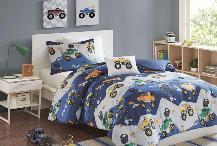 Cruise off to dreamland with the Mi Zone Kids Nash Printed Comforter Set. This ultra-soft blue and grey comforter and shams (1 in Twin/TwinXL) features a colorful monster truck print and a solid blue reverse to create a fun and exciting look. An oblong decorative pillow with a plush applique truck on the face completing the comforter set. Machine washable for easy care