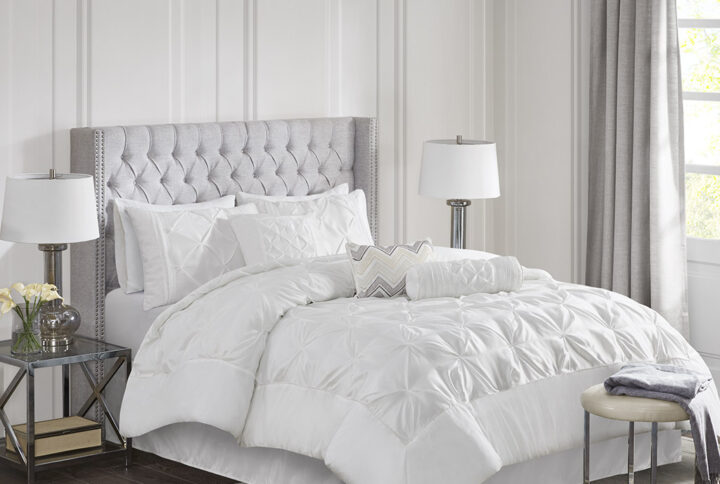 This beautifully tufted bed is from the Laurel bedding collection. Its white coloring makes this set easy to accessorize in your bedroom. The collection is made from 100% polyester polyoni and has pieced fabric sewn together to give this set added dimension. It is finished with a smooth edge of fabric that creates a beautiful border around this comforter. Items in the set may come in a rolled or compressed packaging