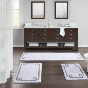 The Madison Park Evan Cotton Tufted Bath Rug provides the perfect balance of comfort and style to update your bathroom. This tufted bath rug features a contrasting grey border on a soft neutral ground creating a clean hotel look