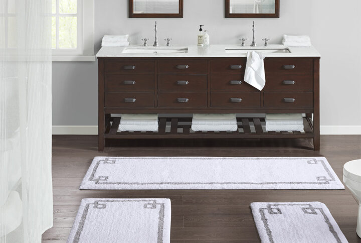 The Madison Park Evan Cotton Tufted Bath Rug provides the perfect balance of comfort and style to update your bathroom. This tufted bath rug features a contrasting grey border on a soft neutral ground creating a clean hotel look