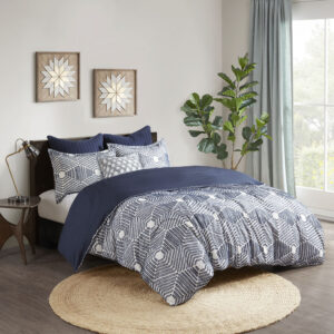 Add a rich textural look to your bedroom with the INK+IVY Ellipse Cotton Jacquard Comforter Set. The cotton comforter features a geometric design in a navy clipped jacquard with a solid navy reverse that complements the top of the bed