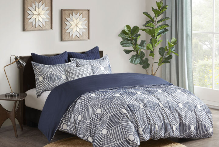 Add a rich textural look to your bedroom with the INK+IVY Ellipse Cotton Jacquard Comforter Set. The cotton comforter features a geometric design in a navy clipped jacquard with a solid navy reverse that complements the top of the bed