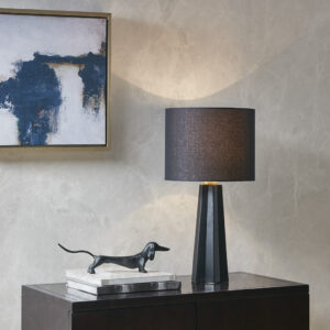 modern touch to your home with the Martha Stewart Athena Geometric Ceramic Table Lamp. This ceramic table lamp features modern fluted design in a matte black finish with a black shade to create a sophisticated contemporary look. The drum shade is made from linen and is not adjustable. Flaunting a simple and clean design