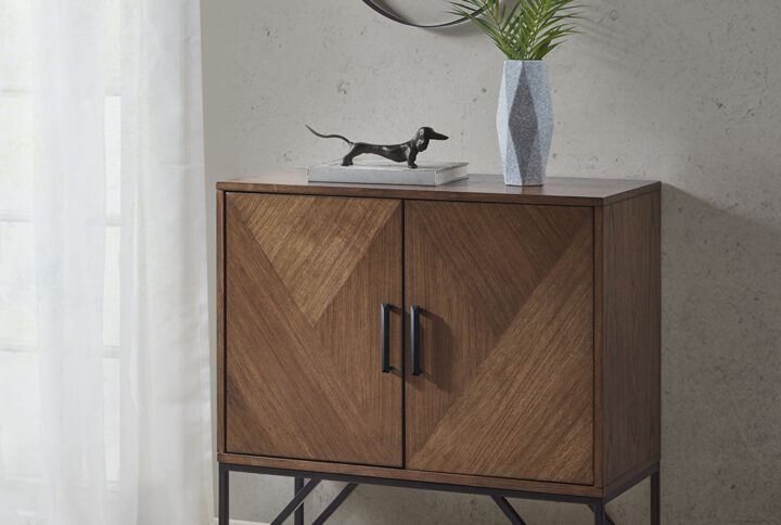 The INK+IVY Krista Accent Cabinet offers a sophisticated storage update for your home. This accent cabinet features a brown wood finish with a matte black finish on the metal base