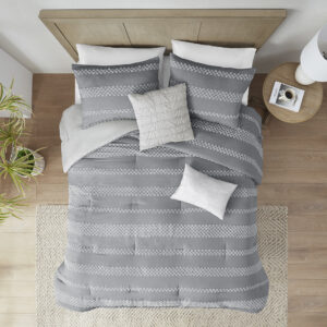 this striped comforter set revitalizes your bed with bold style and refined comfort. The comforter features a gray and white clipped jacquard stripe design with a solid light gray reverse to create texture and dimension. Handsomely tailored matching shams and 2 decorative pillows provide the finishing touches to this expertly crafted casual bedding set.