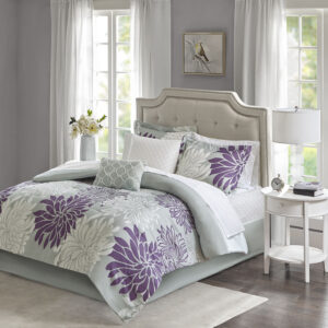 Transform your bedroom into a comfortably casual retreat with the Madison Park Essentials Maible Complete Comforter and Cotton Sheet Set. A beautiful printed floral design