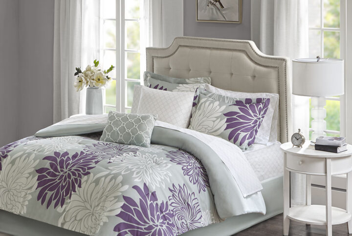 Transform your bedroom into a comfortably casual retreat with the Madison Park Essentials Maible Complete Comforter and Cotton Sheet Set. A beautiful printed floral design