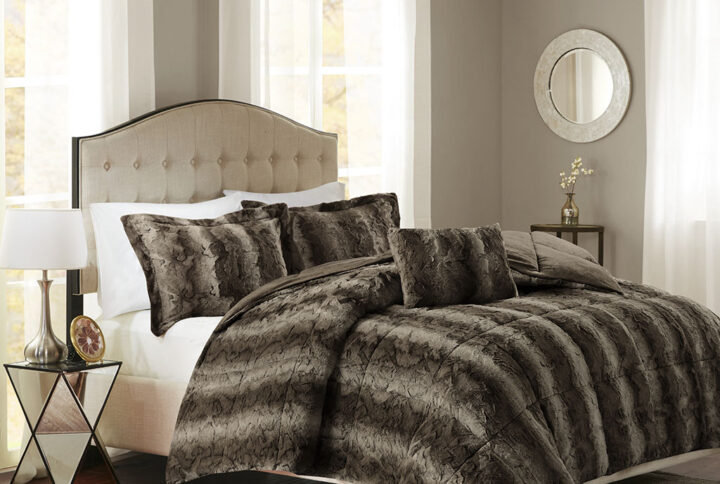 Snuggle up for a luxurious sleep with the Madison Park Zuri Comforter Set. This set features an ultra-soft faux fur front