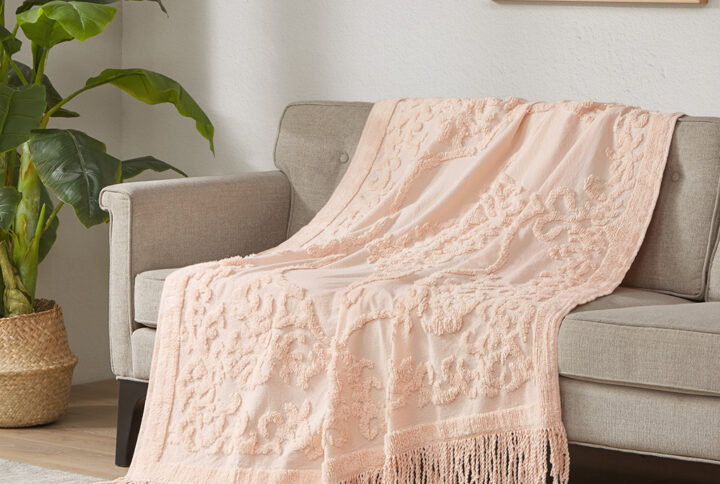 The Madison Park Chloe Cotton Tufted Throw provides a luxurious addition to your home decor. This blush throw flaunts an elegant tufted chenille design with a 4-inch fringe on each end