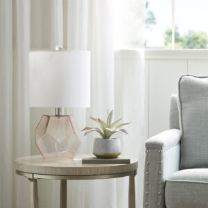 Elevate your home decor with the unique style of the 510 Design Bella Geometric Glass Table Lamp. This table lamp features a pink glass base with a white drum shade that creates a beautiful and eye-catching contrast. A 60-inch clear cord provides plenty of length to fit this glass table lamp in any room of your home. With simple and clean design