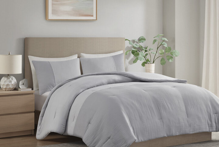 Refresh your bedroom with the subtle beauty of the Beautyrest Miro gauze comforter set. This lightweight comforter features a gray two-tone pieced design that embraces a more casual look with a touch of elegance. Matching shams repeat the modest style of the comforter to complete the oversized bedding set and give your room a chic neutral update that mixes well with a variety of styles.