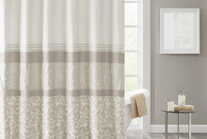 Complete your bathroom with the charm of our 510 Design Ramsey Printed and Embroidered Shower Curtain. This microfiber shower curtain features a printed and pieced design in cool neutral hues for a soft and traditional look. Elegantly embroidered details add a sophisticated touch