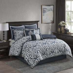 Add a touch of class to your bedroom with the Madison Park Odette 8 Piece Jacquard Comforter Set. The luxurious textured jacquard comforter and shams flaunt a gorgeous damask medallion design with silver striations on the satin ground that add dimension to the lavish look. A solid navy reverse and stunning Euro shams complement the top of the bed to complete the ensemble. Also included are two decorative pillows that feature embroidery and cording details