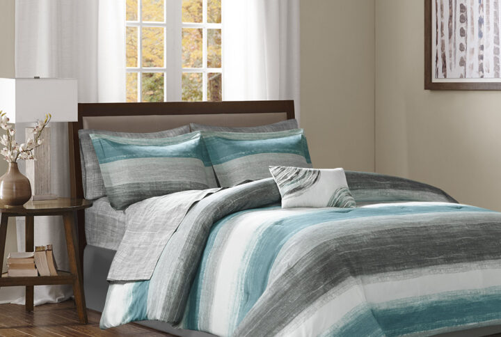 The Madison Park Essentials Saben Complete Comforter and Cotton Sheet Set provides a modern update to your bedroom. A watercolor stripe print is beautifully displayed on the ultra-soft microfiber comforter. The matching shams (1 in Twin Sizes) mirror the pattern of the comforter