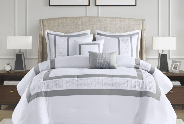 510 Design presents the Powell 8 Piece Embroidered Comforter Set to elevate your bedroom decor. This hotel style white comforter features an embroidered and pieced border for a sophisticated and elegant design that easily coordinates with your space. The matching pillow shams also flaunt beautiful embroidery details