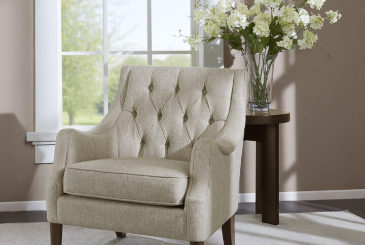 Elevate your living room with the vintage-inspired style of the Madison Park Qwen Button Tufted Accent Chair. This accent chair is upholstered in a soft