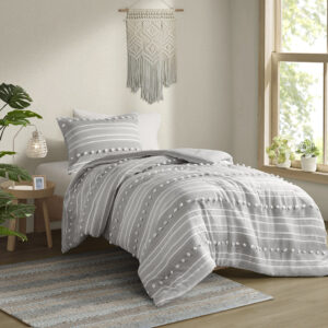 The Urban Habitat Rowan comforter set features cationic dyed stripes and clip jacquard pompom details that bring a perfect blend of modern and casual style to your bedroom. The comforter has a soft microfiber reverse