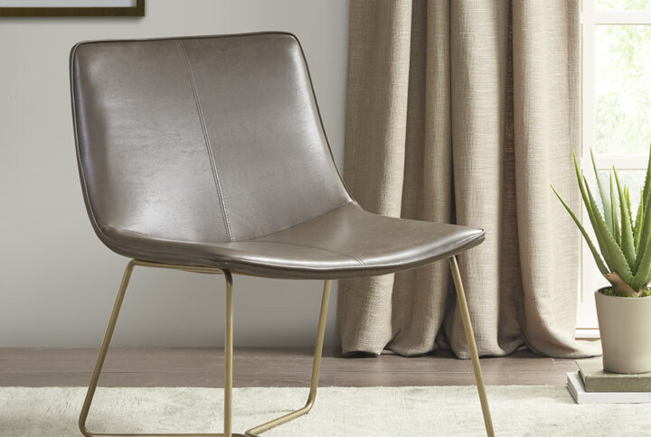 The Madison Park Fallon Accent Chair adds a sharp and sophisticated update to your living room or home office. This accent chair is upholstered in brown polyurethane leather with a gold metal base to create a sleek modern look. Flaunting a simple and clean design