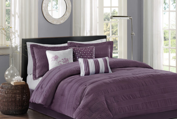 The Madison Park Hampton Collection adds dimension with the use of fabric manipulation. This unique polyester jacquard fabric has a wrinkle feature that is used in a striped fashion horizontally across the comforter and shams. The deep plum used in this set gives a modern feel that be easily be added into your current decor. Three decorative pillows use the top of bed color along with a heather grey for a chic finish.