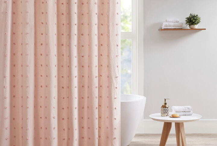 Create a shabby chic look in your bathroom with the Urban Habitat Brooklyn Cotton Yarn Dyed Jacquard Pom Pom Shower Curtain. This 100% cotton shower curtain features a soft pink hue with an all-over pom pom tuft design that creates a beautiful texture and fresh tonal pattern. Measuring 70x72 inches