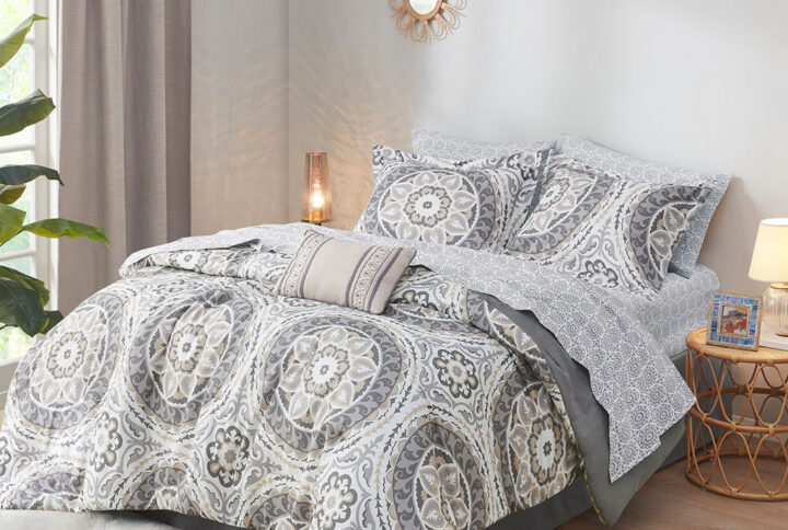 The Madison Park Essentials Serenity Complete Comforter and Cotton Sheet Set provides a fresh globally inspired look for your bedroom. An intricate medallion pattern repeats across the top of bed in brilliant shades of complementary colors to play up the oversized print. An oblong pillow uses decorative embroidery and piecing to create texture on the top of bed. Also included is a complete cotton sheet set that features a coordinating medallion print to complete the look. Bringing the best in health and wellness