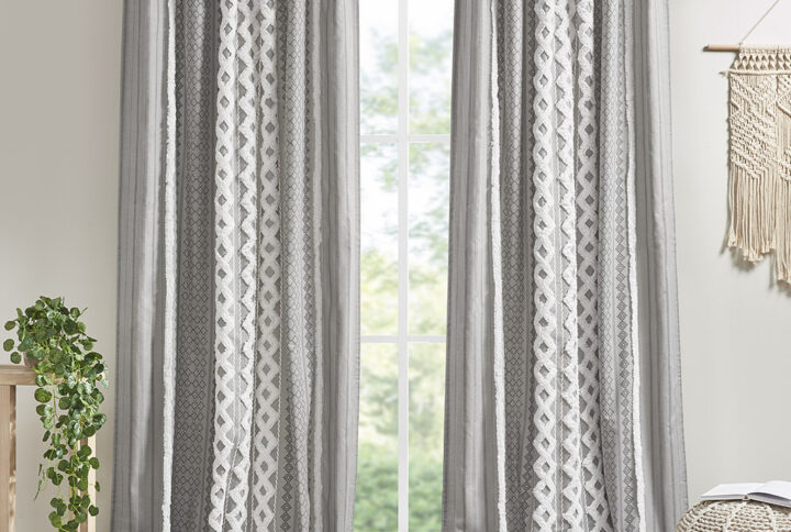 The INK+IVY Imani Cotton Printed Window Panel with Chenille Stripe and Lining offers a chic and casual update to your home. This gray window panel features a geometric print with a tufted chenille stripe trim