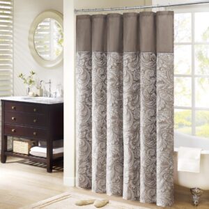 The Madison Park Aubrey Polyester Jacquard Shower Curtain creates a sophisticated modern look in your bathroom. The pieced design flaunts a beautiful woven jacquard in an updated paisley motif with a large solid stripe at the top of the shower curtain. This jacquard shower curtain is machine washable for easy care. Complete the collection and look with coordinate bath towels