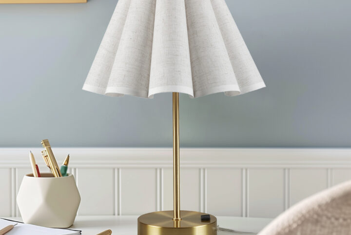 Elevate your space with the Chique Accent Table Lamp by 510 Design—where elegance meets practicality. Its gracefully tapered lamp shade features an elegant