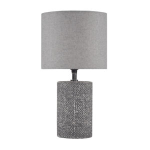 grey ceramic base flaunts a chic textured pattern that adds dimension to this table lamp