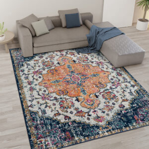 this area rug features a boho-inspired medallion pattern in shades of orange and blue creating a vibrant globally inspired look. The soft