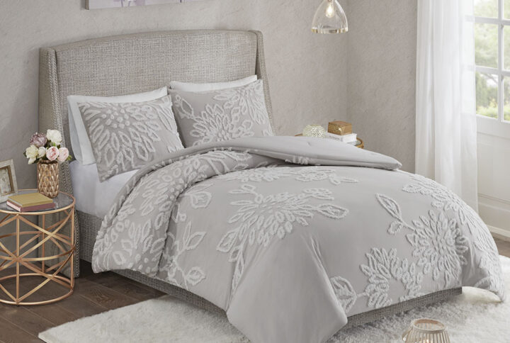 Complete your bedroom decor with the Madison Park Veronica 3 Piece Tufted Chenille Floral Comforter Set. The shabby chic comforter features white cotton tufted chenille floral pattern on a warm grey background that creates a lovely contrast. The 2 matching shams mirror the design of the comforter to complete the farmhouse aesthetic