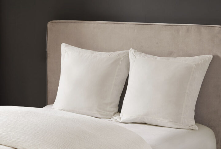 Complete your beautiful bedding set with the N Natori Hanae Euro Sham. This luxurious Euro sham features a cotton blend eggshell white yarn-dyed fabric with decorative flange for a detailed textural appeal. A hidden zipper opening creates a clean edge that keeps your pillow secure. With its simple design