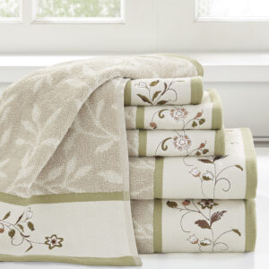 Add a touch of elegance to your bathroom decor with our Madison Park Serene Embroidered Cotton Jacquard 6 Piece Towel Set. These cotton towels feature a jacquard leaf pattern with a floral embroidered hem