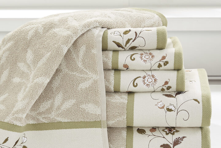 Add a touch of elegance to your bathroom decor with our Madison Park Serene Embroidered Cotton Jacquard 6 Piece Towel Set. These cotton towels feature a jacquard leaf pattern with a floral embroidered hem