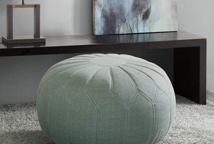 This oversized ottoman pouf will make a statement in any home. Filled with polystyrene beads