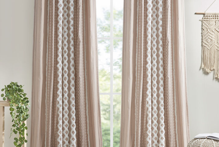 The INK+IVY Imani Cotton Printed Window Panel with Chenille Stripe and Lining offers a chic and casual update to your home. This blush window panel features a geometric print with a tufted chenille stripe trim