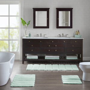 Transform your bathroom into a simple and stylish haven with our Madison Park Tufted Pearl Channel Rug. This solid tufted bath rug features a high-low stripe design with a light sheen and luster that adds rich dimension and texture for the perfect shabby chic touch your bathroom decor. Constructed from 100% macro-spun polyester fibers