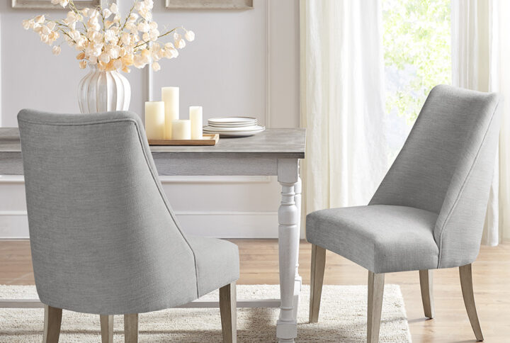 Complete your dining room decor with the Martha Stewart winfield cining chair set of 2. Each dining chair is upholstered and features a reclaimed finish on the solid wood legs