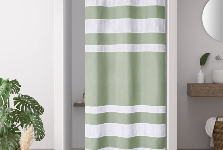 Update your space with the Madison Park Spa Waffle Shower Curtain with 3M Treatment. Featuring a fresh and updated stripe design