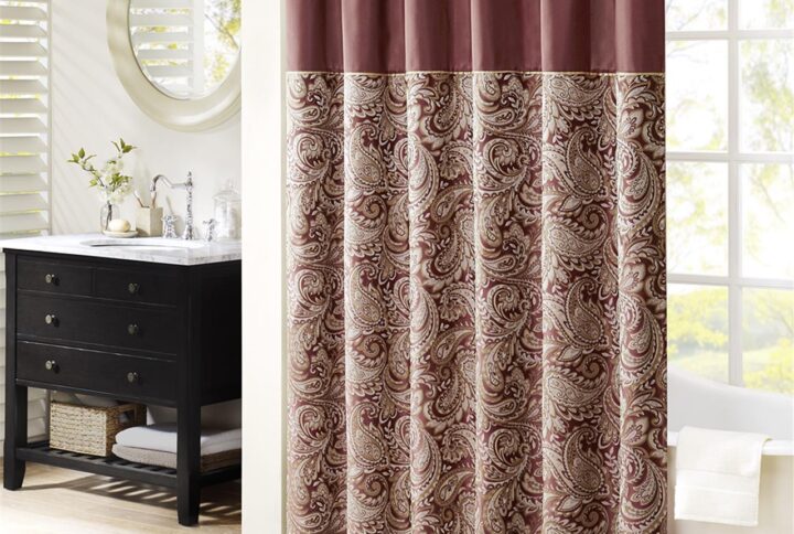 The Madison Park Aubrey Polyester Jacquard Shower Curtain creates a sophisticated modern look in your bathroom. The pieced design flaunts a beautiful woven jacquard in an updated paisley motif with a large solid stripe at the top of the shower curtain. This jacquard shower curtain is machine washable for easy care. Complete the collection and look with coordinate bath towels